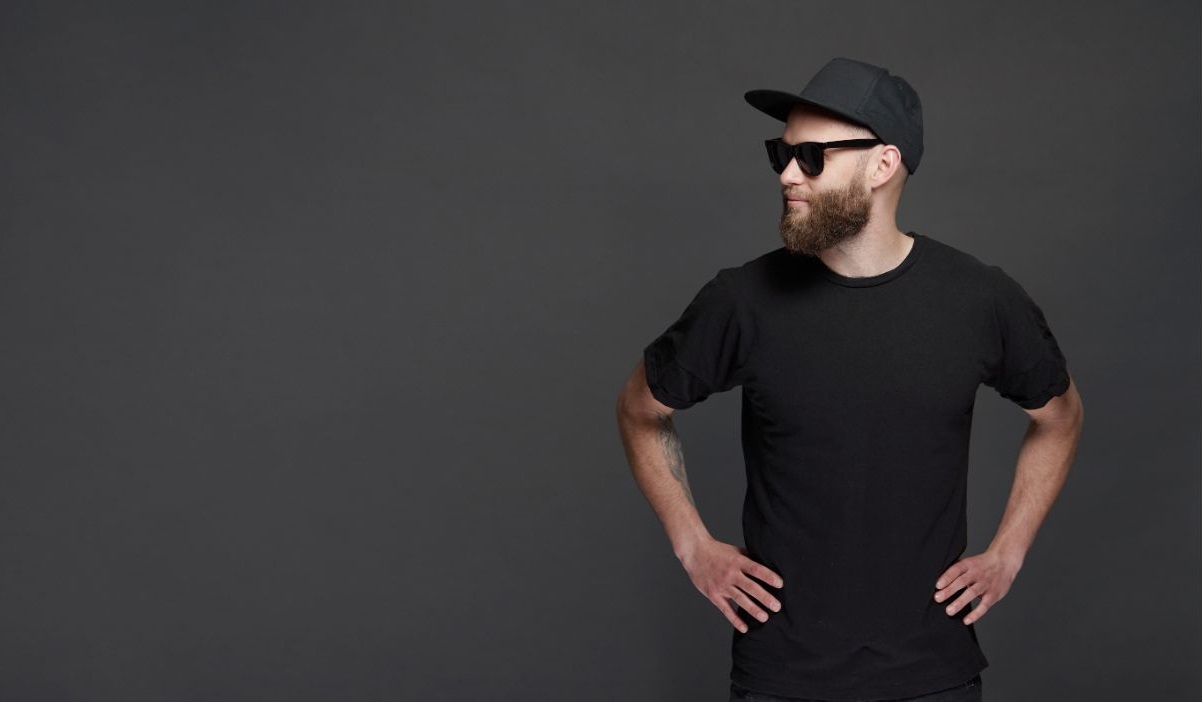 A guy with black shirt and a cap