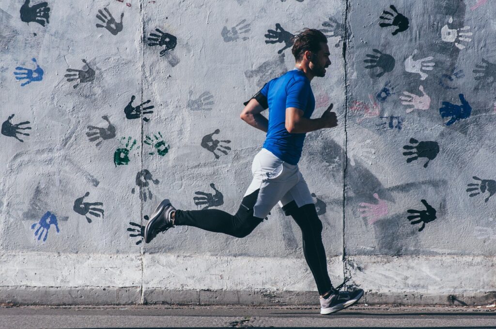 man running in tight fitness clothing